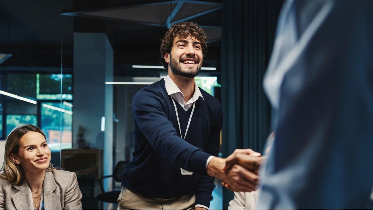 Colleagues shaking hands during a business meeting